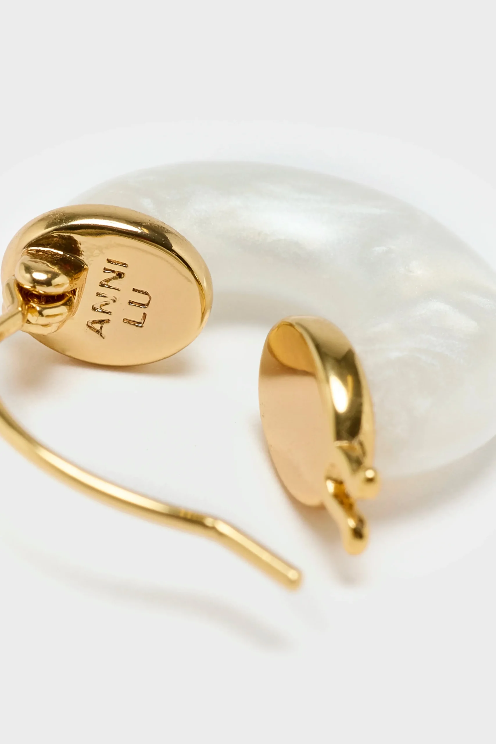 anni_lu_petit_white_swell_3.webp Anni Lu Petit White Swell Hoop Earrings